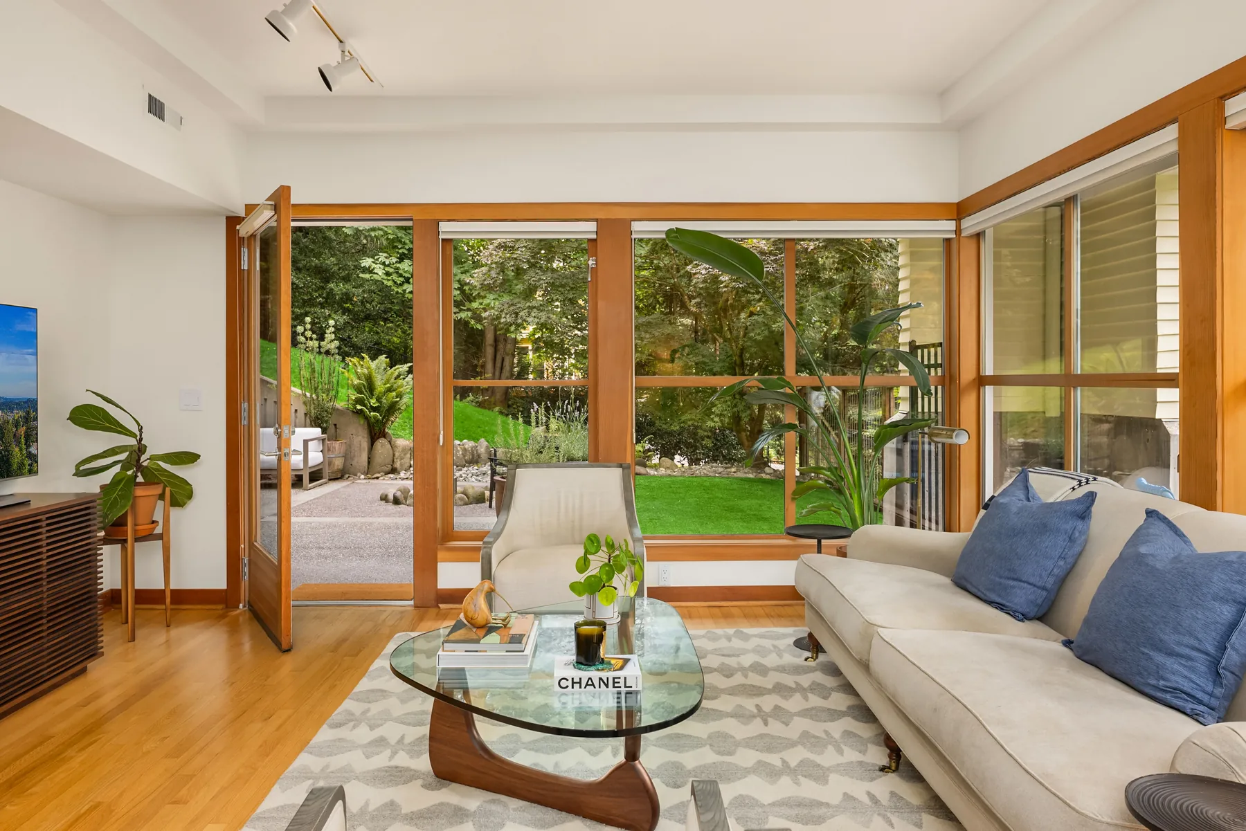 Sunroom with Douglas fir-framed sliding doors opening to the garden
